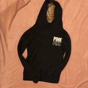 Graphic pink sweatshirt with a tiger print inside